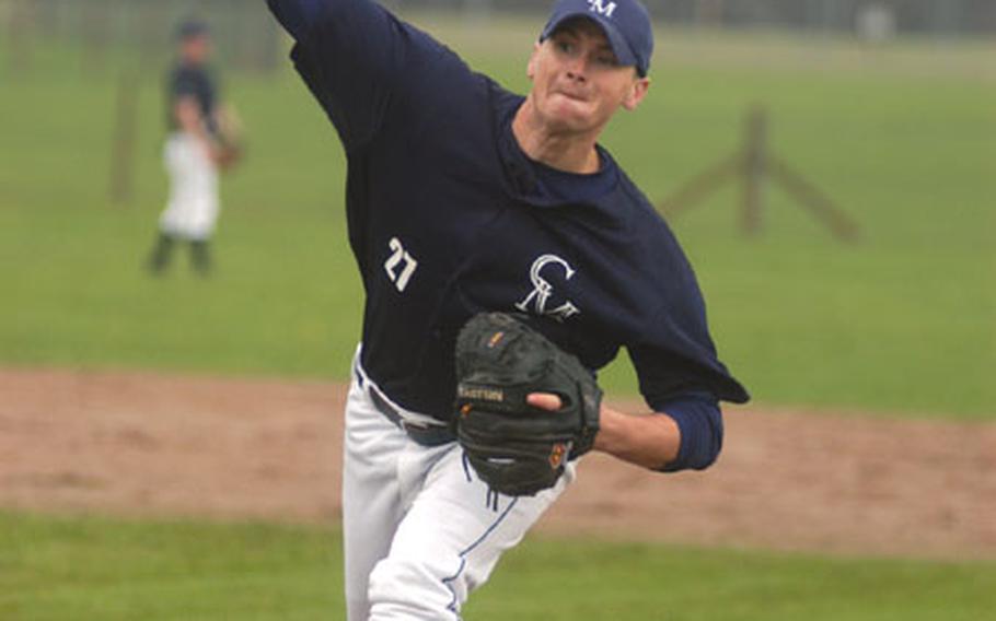 Senior Airman Eric Baxter of the 48th Equipment Maintenance Squadron at RAF Lakenheath, England, delivers a pitch during a baseball game at RAF Feltwell, England.
