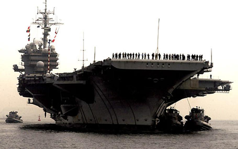 The USS Kitty Hawk returns from deployment.