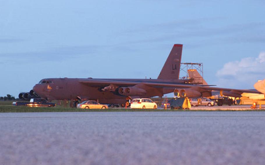 A pair of B-52 Stratofortresses arrives at Andersen Air Force Base on Tuesday evening.