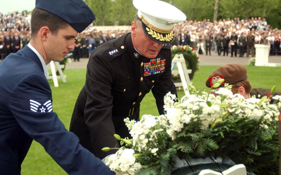 Gen. James Jones, center, commander of the European Command, lays a wreath Sunday during a Memorial Day ceremony at the Netherlands American Cemetery and Memorial in Margraten, Netherlands.