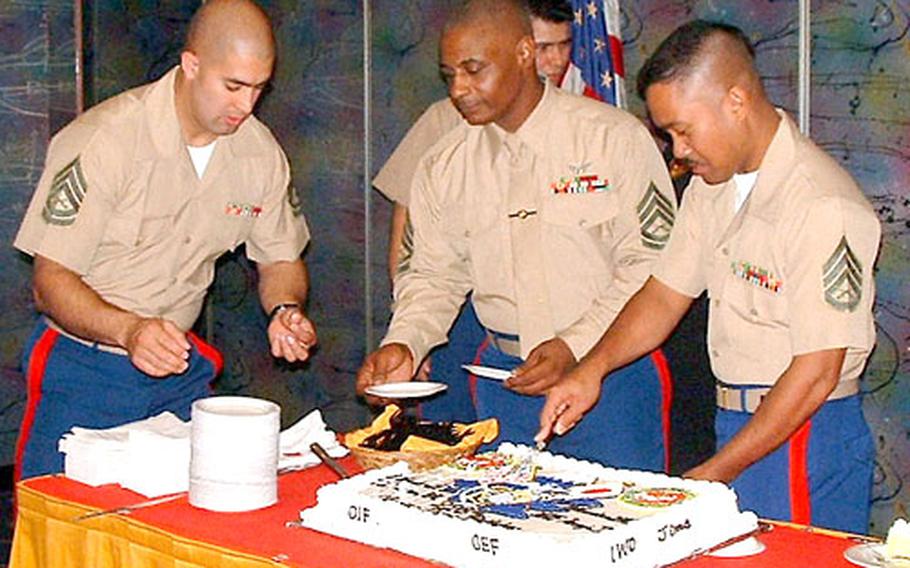 The nine Marines stationed at Atsugi Naval Air Facility maintain Marine traditions, including the cake-cutting ceremony to honor the Corps&#39; birthday.
