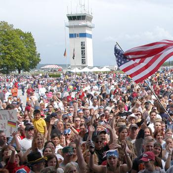 Fans cheer Monday as the start of the free Toby Keith/Ted Nugent Memorial Day concert draws near in Illesheim, Germany in 2004.