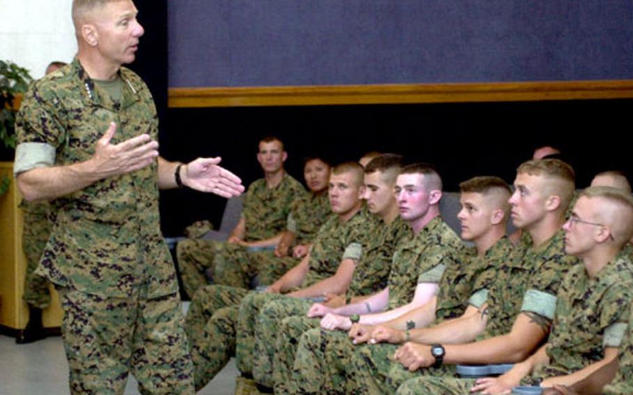 Gen. Michael Hagee, U.S. Marine Corps commandant, talks Tuesday to members of Marine Corps Security Force Company Europe in the base theater at Naval Station Rota, Spain.