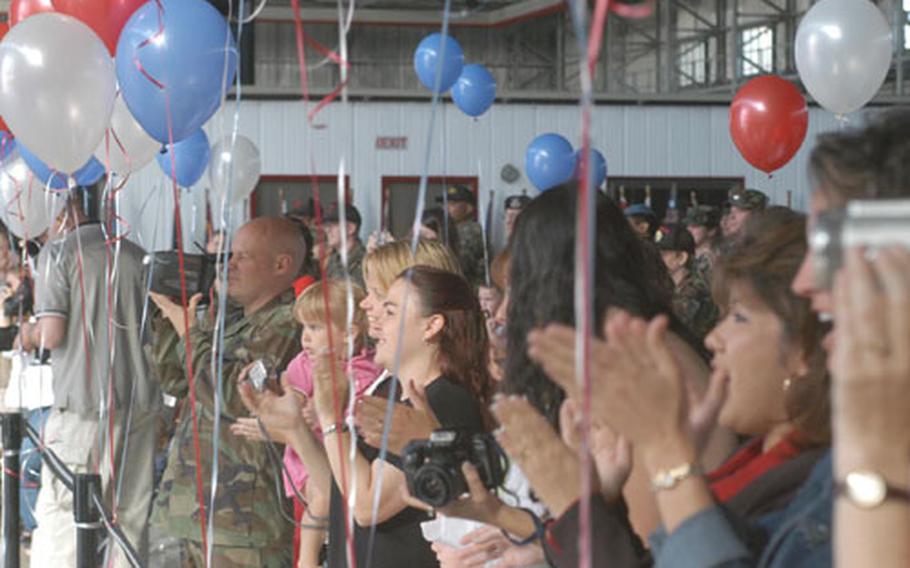 Families and community members cheer the return of the 603rd Air Control Squadron to Aviano Air Base on Thursday. Hangar 1 was crowded with family members and active-duty personnel eager to see the airmen return to their home base from a six-month deployment in Iraq.