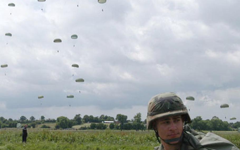 Staff Sgt. James L. Cannon of the Vicenza, Italy-based 173rd Airborne Brigade stands in a field on the outskirts of Ste. Mere-Eglise, France, after he parachuted down on Saturday. More than 600 soldiers from the 173rd and the 101st and 82nd Airborne Divisions jumped from U.S. Air Force C-130 and C-17 airplanes.