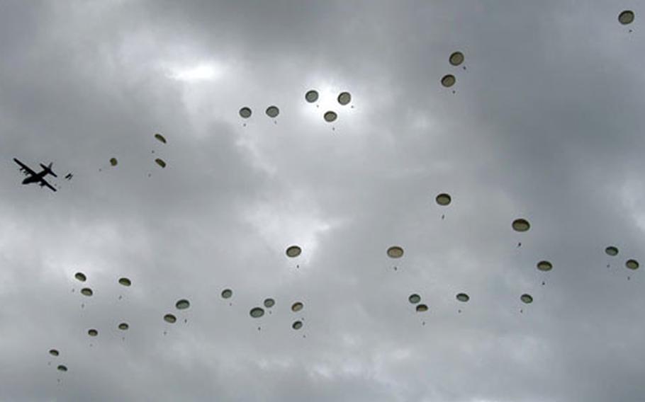 Parachutes fill the sky over Normandy as 610 soldiers from the 101st and 82nd Airborne Divisions and the 173rd Airborne Brigade jumped from U.S. Air Force C-130 and C-17 airplanes near Ste. Mere-Eglise on Saturday.