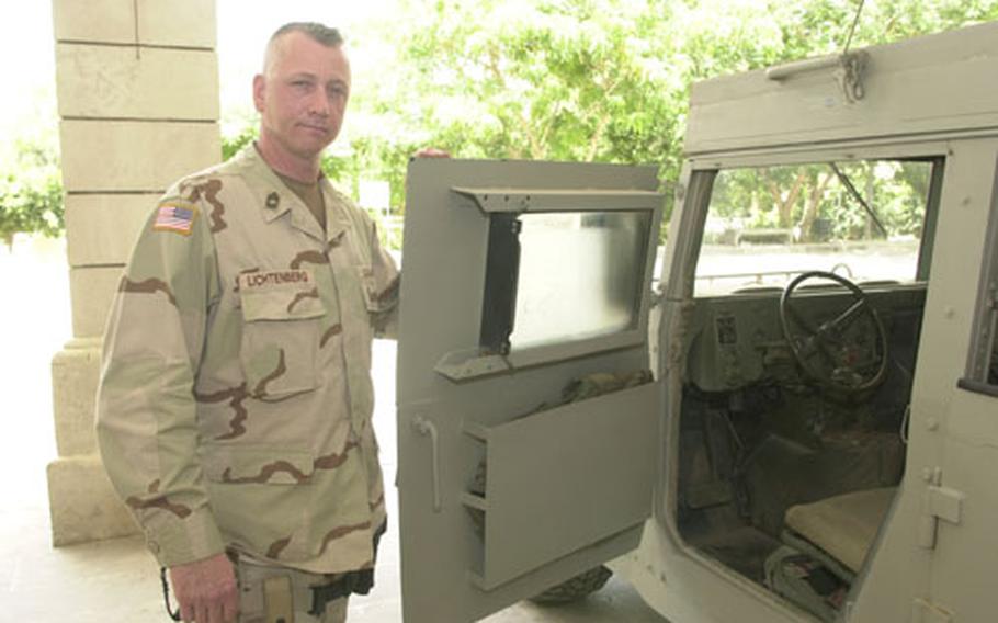 Master Sgt. Dennis Lichtenberg shows the inside of the "bullet box" on the driver&#39;s side door of one of his specially modified Humvees. Note the old schrapnel vest Lichtenberg inserted, one more energy-absorbing measure between the exterior and interior steel plate.