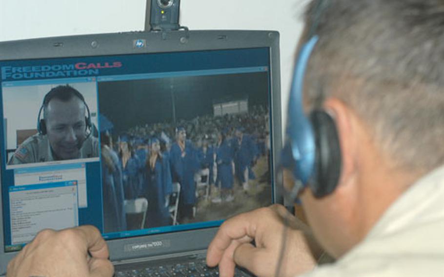 Staff Sgt. Jacques Rodriguez, who is attached to the 1452nd Transportation Company out of North Carolina, watches students of the Class of 2004 from Southwest High School in El Centro, Calif., prepare for graduation. His son Joshua Christopher Rodriguez, 18, will follow a family tradition after commencement and join the Army to become a helicopter pilot.