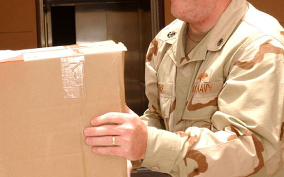 Builder Chief (SCW) Scotty Arias moves safety supplies to the Bahrain-based headquarters of Commander, U.S. Naval Forces Central Command/ Commander, U.S. Fifth Fleet. Arias serves as the Navy&#39;s safety chief for the entire AOR, and is only the fifth amputee in U.S. Navy history to be medically cleared to serve on active duty.
