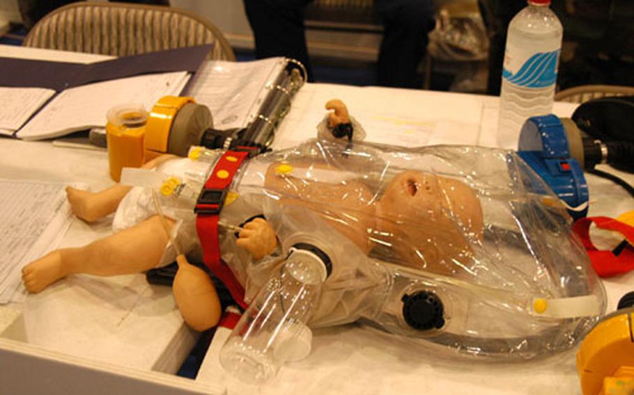 A doll used to demonstrate children&#39;s nuclear, biological and chemical protective equipment at the Desert Strike Family Readiness Exercise on Friday.