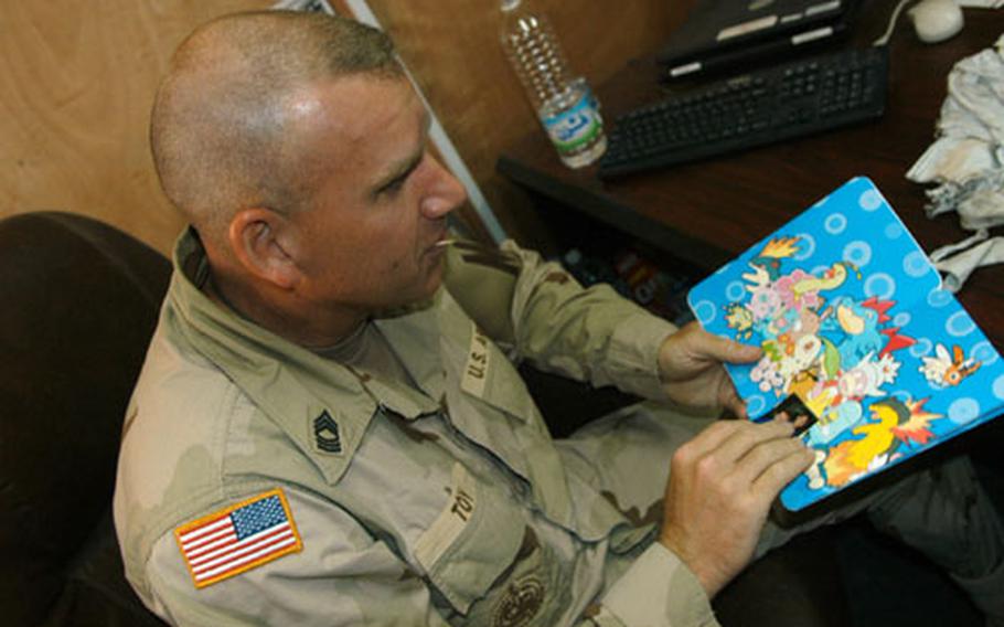 Father’s Day cards came in the mail for Master Sgt. Scott Toy, of the Mannheim, Germany-based 95th Military Police Battalion currently on duty in Baghdad.