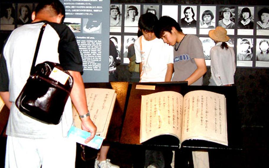 Visitors to the Himeyuri Peace Museum read the testimonies of girls pressed into service as nurses&#39; aides during the Battle of Okinawa.