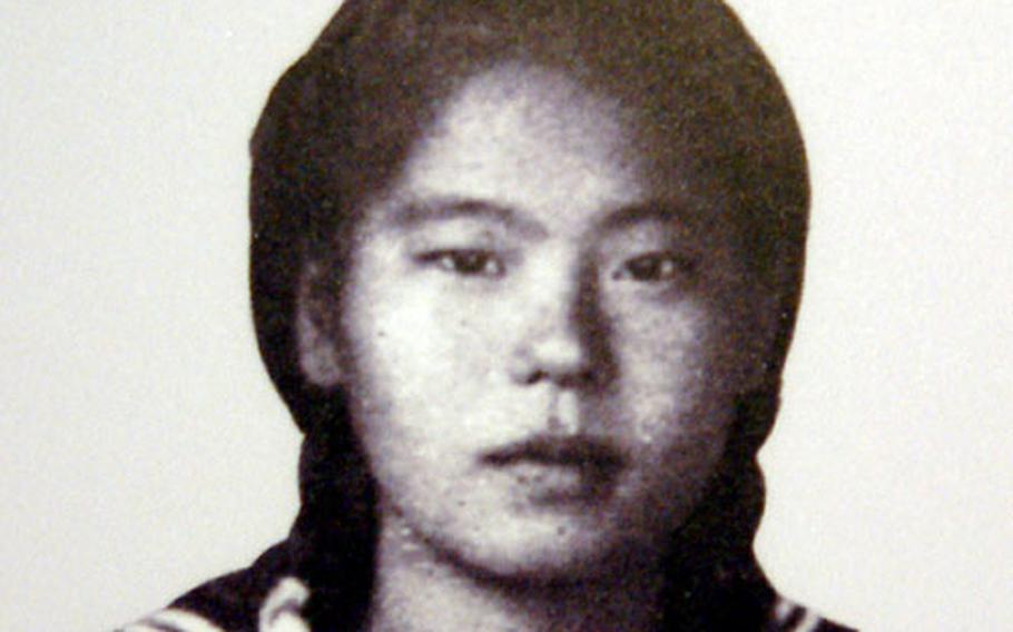Tsuru Motomura, pictured here in a class photo taken when she was 19, is now the curator of the Himeyuri Peace Museum.