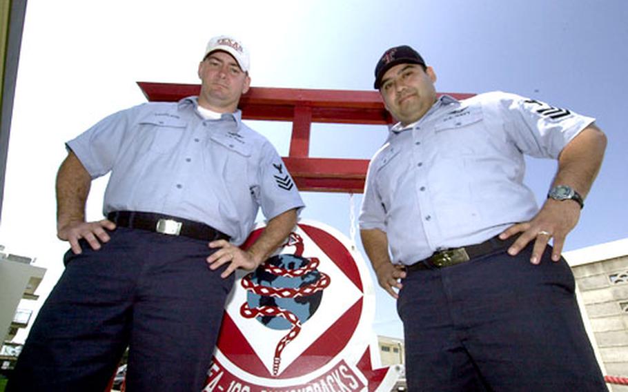 Petty Officers 1st Class Joe Lovelace, left, and Jorge Gonzalez of Strike Fighter Squadron 102 discovered they had something in common when they found they were both from neighboring small towns in west Texas.