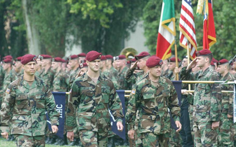 Col. Kevin Owens, the incoming commander of the 173rd Airborne Brigade, Maj. William Butler and Col. Bill Mayville, the outgoing brigade commander, review the troops Friday during the change-of-command ceremony at Caserma Ederle in Vicenza, Italy.