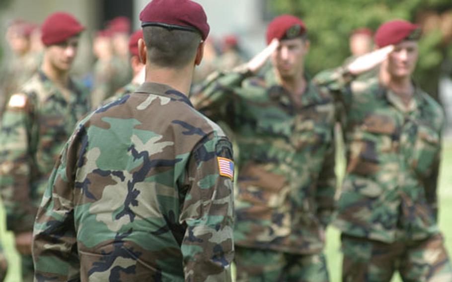 Col. Kevin Owens, the new commander of the 173rd Airborne Brigade, reviews soldiers as they march past him during the change-of-command ceremony Friday at Caserma Ederle in Vicenza, Italy.