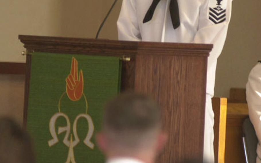 Navy Petty Officer 1st Class Danny Blumer talks about Petty Officer 2nd Class Tim Sporleder during a memorial service on Friday at the base chapel at Naval Station Rota, Spain. Sporleder, a member of Aviation Intermediate Maintenance Unit Rota, was killed in a car accident this past weekend.
