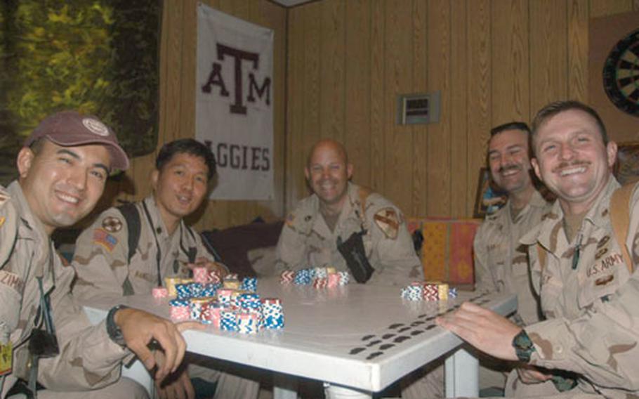 Rounders from Headquarters and Headquarters Company, 1st Cavalry Division&#39;s surgeon section in Baghdad said playing poker helps them work together better as team, as well as releases stress from demanding work hours while deployed.