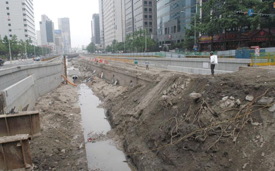 Seoul is restoring a formerly natural flowing stream in a massive $313 million construction project designed to increase green space and alleviate a bleak concrete cityscape along Cheongye Street. The project, scheduled for completion by September 2005, involved razing an ugly, deteriorating elevated highway running through the middle of the city.