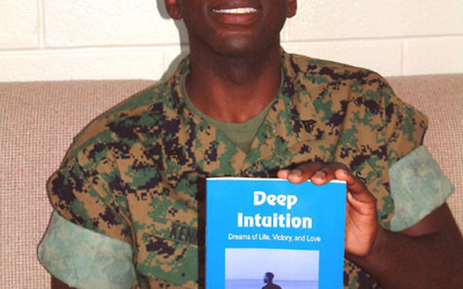Marine Cpl. Alfred L. Kennard and his new book of inspirational poems, "Deep Intuition; Dreams of Life, Victory and Love." He will have a book signing July 3, noon to 3 p.m. at the Camp Foster Main Exchange.