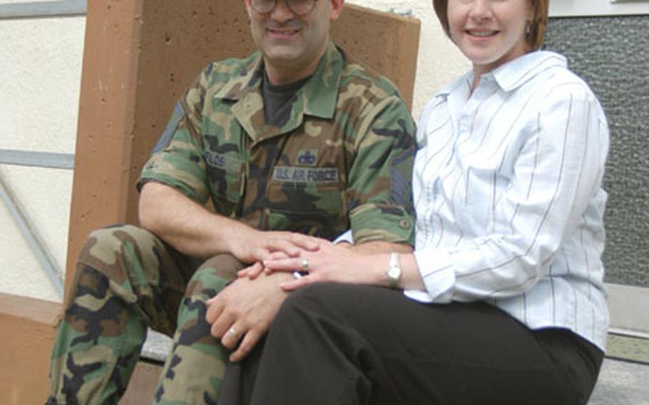 Master Sgt. Phil Filosi and his wife, Sara, sit on the steps of their government-leased housing in Herforst, near Spangdahlem Air Base.