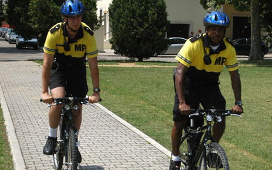 Military policemen Nathan Brumley, left, and Cyril Illidge aren&#39;t limited to the roads on Caserma Ederle or the nearby Villagio housing community when they conduct their bicycle patrols. A parking crunch and construction sometimes make the base a hard place to maneuver cars. Getting around on a bike is usually easier.