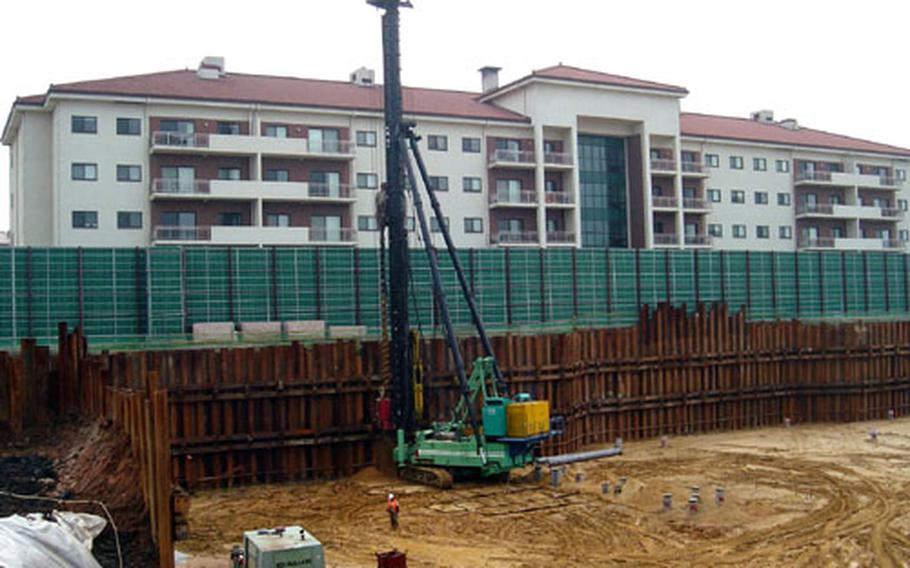 Workers digging an underground parking garage at Camp Humphreys, South Korea, Wednesday. The garage will be part of a three-building family housing complex.