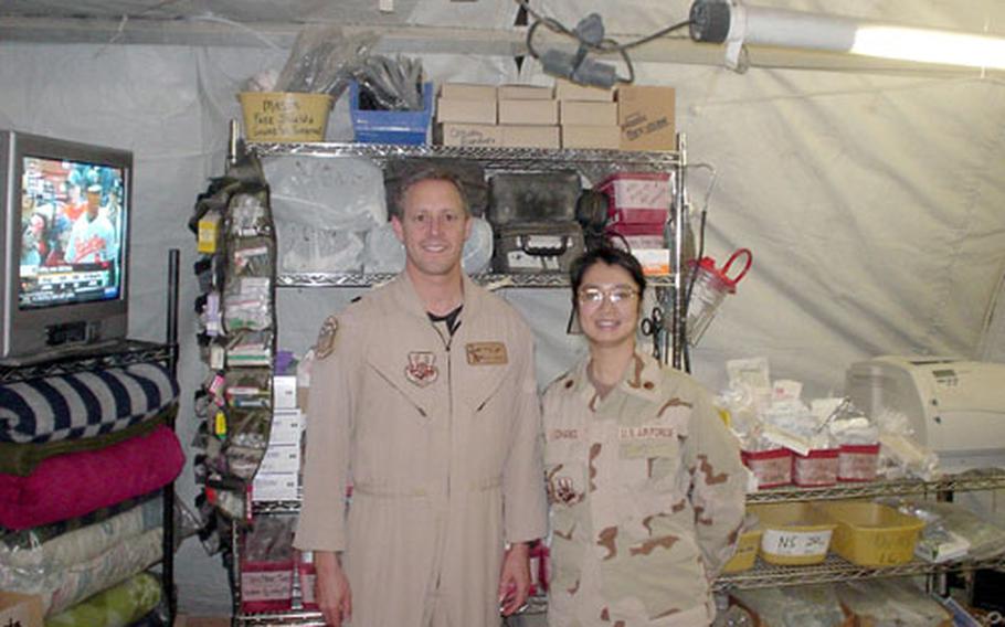 Lt. Col. Mark Coakwell and Maj. Li-ing Chang of Misawa&#39;s 35th Medical Group deployed to Camp Sather in Baghdad this spring, where they were part of an Air Force Expeditionary Medical Squadron that treated more than a thousand patients in three months. Many of the injured were soldiers wounded in battles or by roadside blasts in and around Baghdad.
