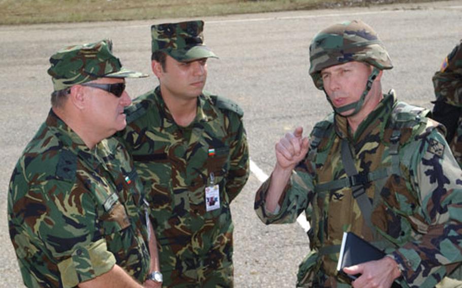 Bulwark 04 Commander Col. John E. Sterling Jr., right, greets Bulgarian Land Forces Maj. Gen. Kirtcho Kurtev, left, at the Novo Selo Training Area, Bulgaria, during Bulgarian Community Leaders Day. Local mayors and other area leaders came to the site Saturday to learn about the workings of the Bulwark 04 exercise.