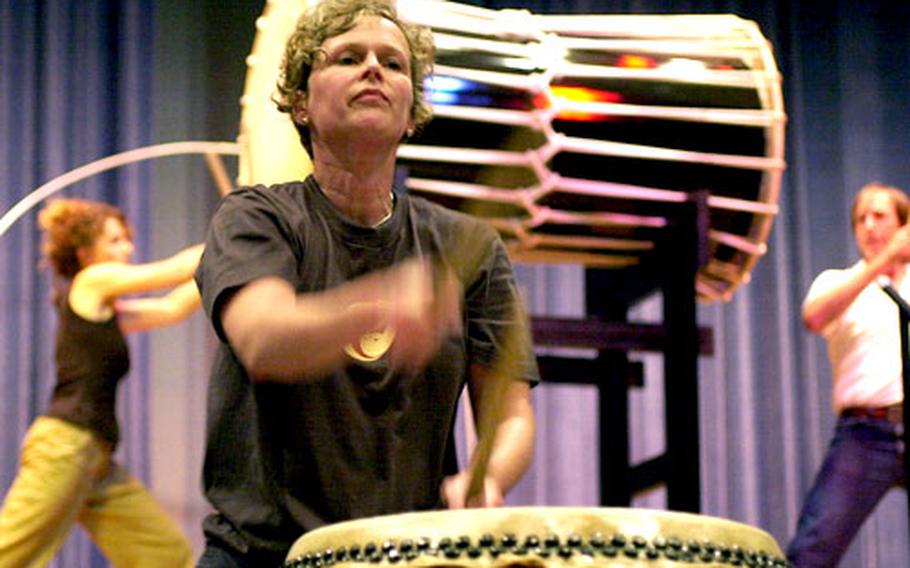 Working on a Taiko drum routine at Yokota Air Base, Denise Ulrich practices for an upcoming performance at the Hachioji Summer Festival.