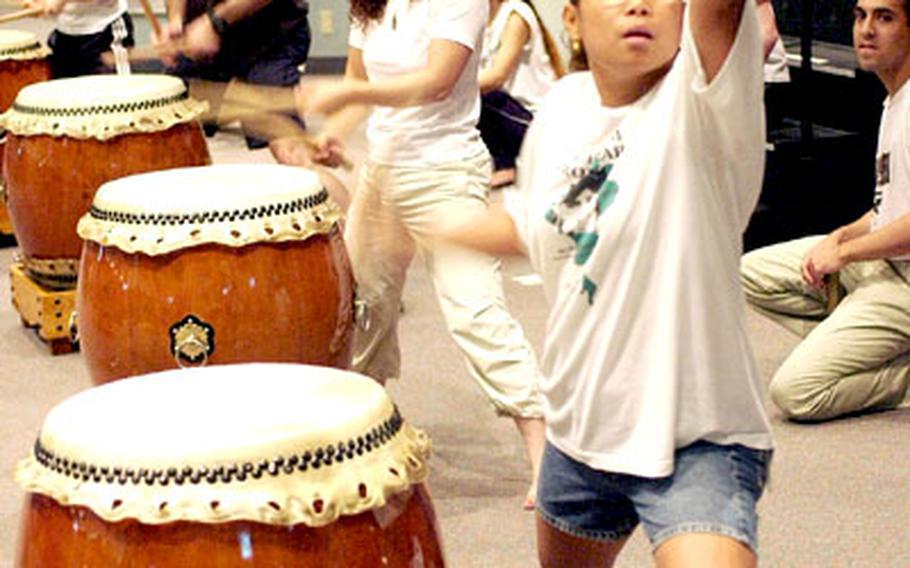 Naomi Boucher works on her drumming solo at the Taiyo Recreation Center at Yokota Air Base.
