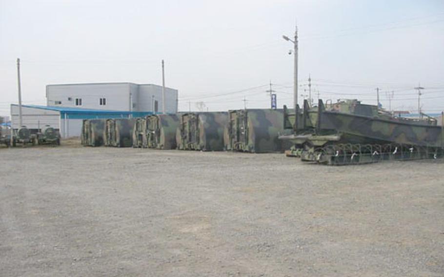 Military equipment sits in a compound on Camp Mu Juk, a remote 84-acre Marine Corps logistics base near Pohang on South Korea&#39;s east coast. The camp, long known among Marines for its austere conditions, is in for a ten-year $60 million overhaul that will turn it into a modern military installation.