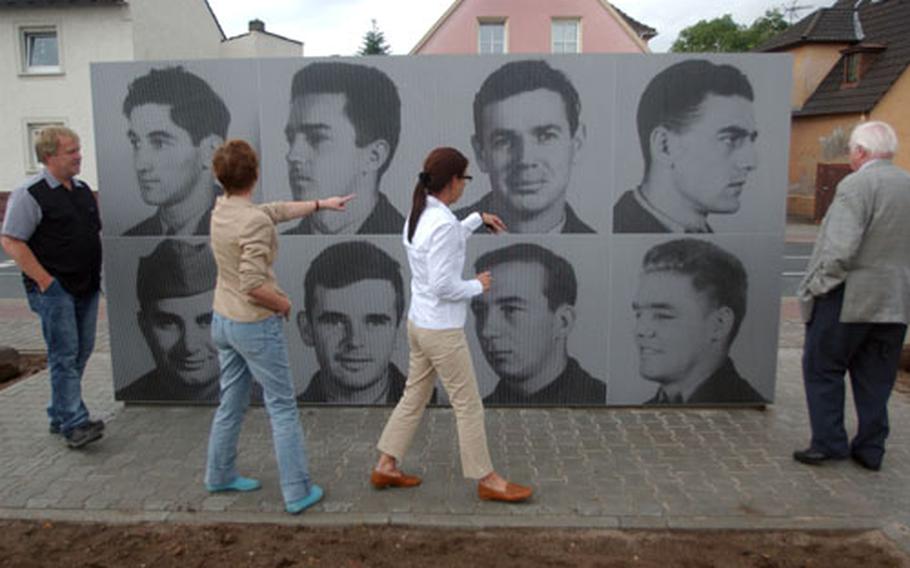 From left, Thomas Poth, Ulrike Jurig, Dagmar Eichhorn and Martin Schlappner get their first look at a monument Tuesday honoring seven U.S. airmen killed by a mob in Rüsselsheim, Germany, during World War II.