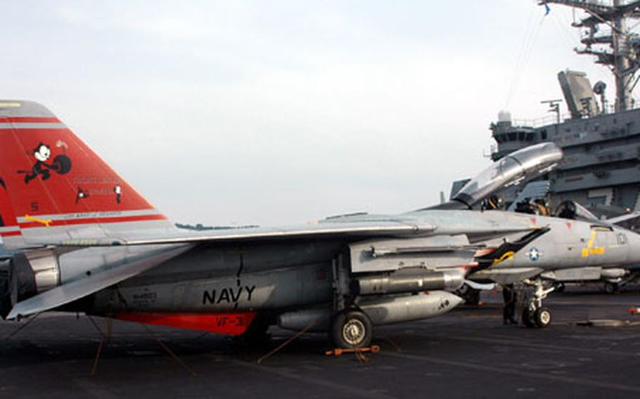 An F-14D Super Tomcat flown by VF-31 squadron from Virginia Beach, Va., sits on the flight deck of the aircraft carrier USS John C. Stennis Tuesday. The airplane is on its last western Pacific deployment this summer. VF-31, also known as the "Felix the Cat Squadron," deploys with the F-14D off the East Coast one more after this summer deployment before the jet is retired entirely from the U.S. Navy aviation arsenal.