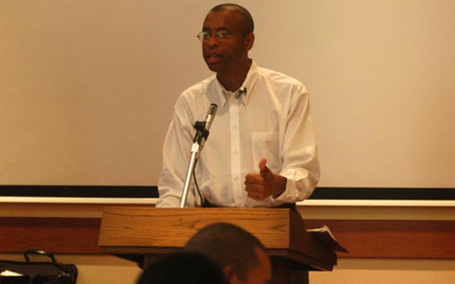 Poet, author and “literary activist” E. Ethelbert Miller makes a point Tuesday during a presentation to soldiers at Caserma Ederle in Vicenza, Italy. Miller and novelist Richard Bausch encouraged soldiers, many of whom deployed to Iraq and will soon head to Afghanistan, to put their experiences to paper. Their visit was part of the National Endowment for the Arts’ Operation Homecoming – designed to document wartime experiences.