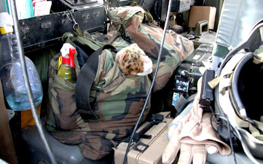 A stuffed tiger belonging to Sgt. Reginald Jones rides in the back of a helicopter as Jones’ unit heads out on missions.