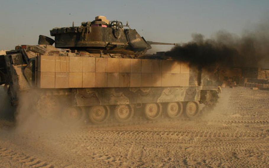 One of the Manchus&#39; Bradley fighting vehicles prepares for action in Iraq across an area of operations that covers 6,000 square kilometers of desert.