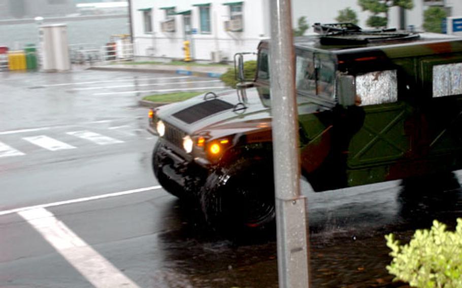 The only vehicles moving on Sasebo Naval Base Tuesday were those operated by the Security Department. The base was closed to all but mission essential personnel.