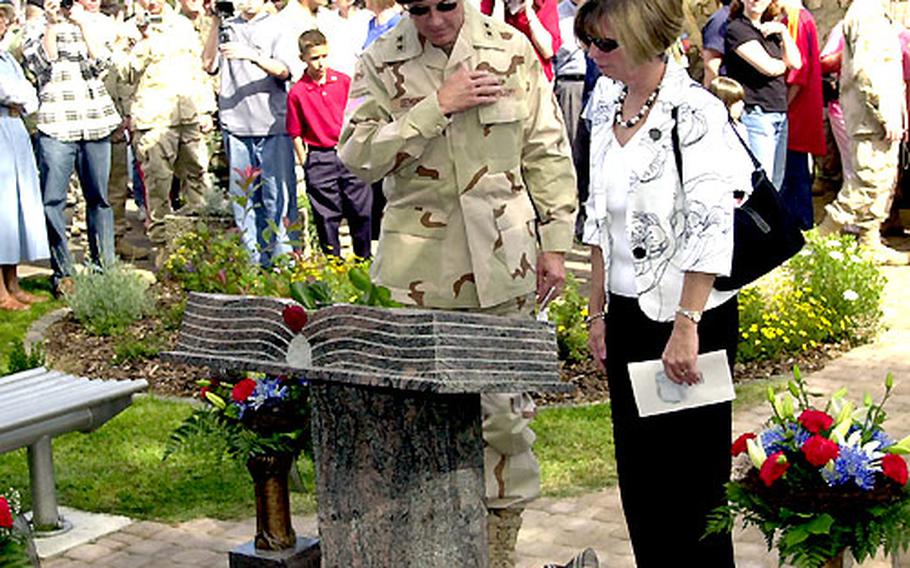 Maj. Gen. Martin E. Dempsey, 1st Amored Division commanding general, and his wife, Deannie, pay their respects Friday at the new memorial to the Baumholder-based 1st AD soldiers who died in Iraq.