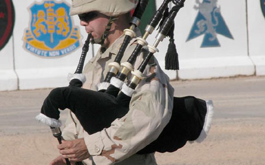 Second Lt. Lee Tate, of Stanton, Va., plays “Amazing Grace” on the bagpipes during a Sept. 11 ceremony at Forward Operating Base O’Ryan, near Balad. The base is home to the New York National Guard’s 2nd Battalion, 108th Infantry Regiment.