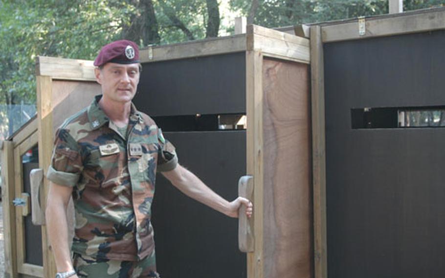 Capt. Paolo Biachesi, the deputy Italian base commander at Camp Darby, talks about a series of fences and gates that will be used to round up deer in the coming months.