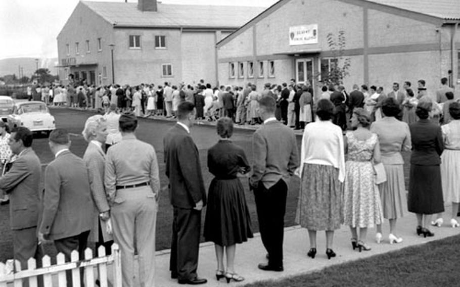 Music fans line up to hear Van Cliburn play at Heidelberg, Germany, August 20, 1958. Those who were unable to get into the theater gathered on the lawn, despite bad weather, to listen through loudspeakers.