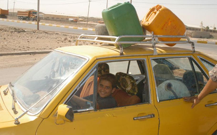 Soldiers from the 2nd Infantry Division&#39;s Battery A, 2nd Battalion, 17th Armored Regiment encountered this young driver selling blackmarket fuel by the roadside during their first patrol in Iraq. The youngster was told to sell the fuel somewhere else since it might be dangerous if an improvised explosive device went off nearby.