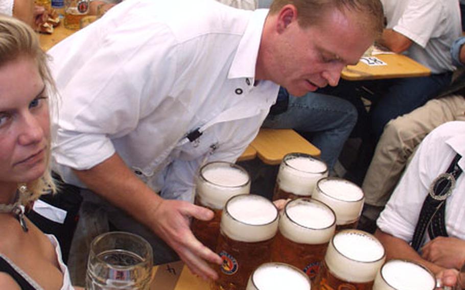 Mmmmm... beer.
A waiter delivers beers to a table Saturday on the first day of the 2004 Oktoberfest in Munich, Germany.