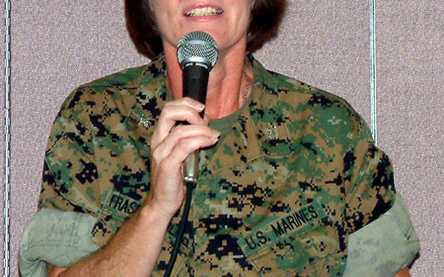 Marine Col. Adrienne Fraser Darling, the new commander of Camps Foster and Lester on Okinawa, addresses a Town Hall meeting on Camp Foster on Thursday night.