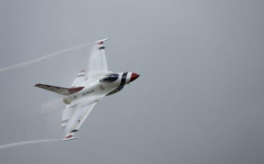 One of the Thunderbirds flight demonstration team, piloted by Maj. Todd Canterbury, flies over the crowd at Sunday&#39;s Osan Air Base air show.