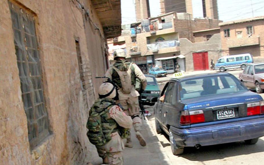 Soldiers from Company C, 1st Battalion, 9th Cavalry Regiment are either on the move during Sunday’s foot patrol mission in the Haifa Street area of Baghdad, or they are taking temporary shelter and waiting to make the next move.