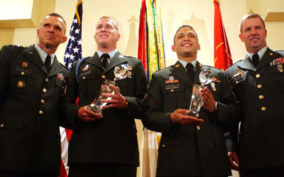From left, Lt. Gen. James J. Lovelace, director of Army staff; Staff Sgt. Andrew J. Bullock, representing Training and Doctoring Command; Spc. Wilfredo A. Mendez, of 8th Army; and Sgt. Maj. of the Army Kenneth O. Preston at the 2004 Department of the Army Noncommissioned Officer and Soldier of the Year competition. Bullock and Mendez received their titles after a week-long testing period.