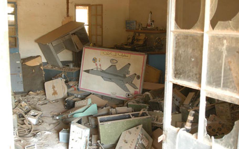 The houses and barracks close to the airstrip at Camp Habbaniyah, Iraq, are full of aircraft parts that Iraqis tried to hide from Coalition bombers last year.