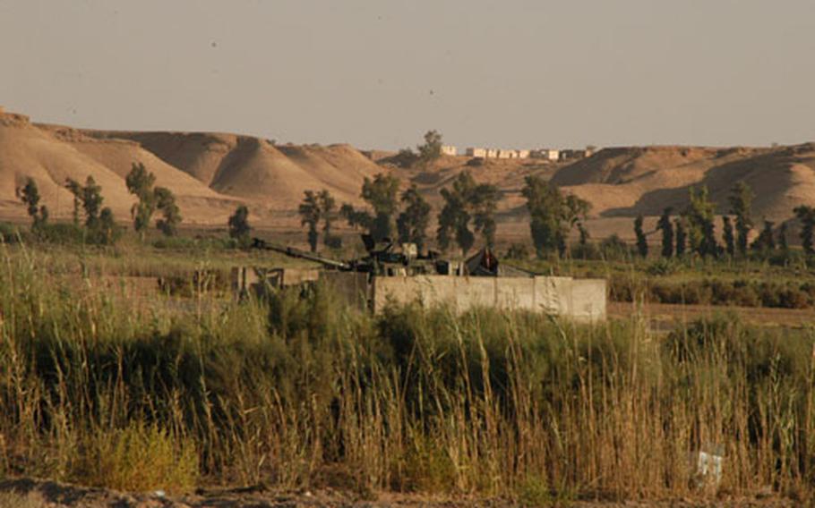 Camp Habbaniyah, Iraq, is an oasis of green surrounded by a desert.